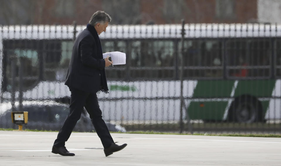 Argentina's President Mauricio Macri arrives to the government house in Buenos Aires, Argentina, Monday, Sept. 2, 2019. Argentina's government decreed on Sunday that Argentines will need authorization from the central bank for the rest of the year to buy U.S. dollars in some cases and make transfers abroad as it tries to prop up its peso currency, following a peso devaluation and ahead of an Oct. 27 election. (AP Photo/Natacha Pisarenko)