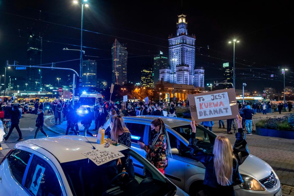 Scuffles erupted between protesters and far-right groups who broke through a police cordon separating them in front of a church in Warsaw (AFP via Getty Images)