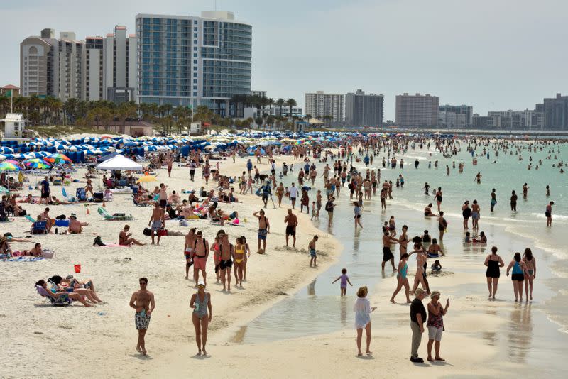 FILE PHOTO: People crowd the beach, while other jurisdictions had already closed theirs in efforts to combat the spread of novel coronavirus disease (COVID-19) in Clearwater