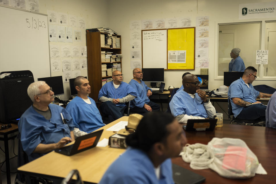 Prisoner-students majoring communications through the Transforming Outcomes Project at Sacramento State (TOPSS) sit in a classroom at Folsom State Prison in Folsom, Calif., Wednesday, May 3, 2023. Congress voted to lift a ban on Pell Grants for prisoners in 2020, and since then about 130 experimental programs have been running, like the one at Folsom. Now, the floodgates will open, and more than 200 colleges have been invited to provide Pell-eligible prison education programs in 48 states, Washington D.C. and Puerto Rico. (AP Photo/Jae C. Hong)