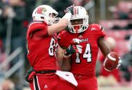 Scott Radcliff #89 and Andrell Smith #14 of the Louisville Cardinals celebrate after Smith caught a touchdown pass during the game against the Temple Owls at Papa John's Cardinal Stadium on November 3, 2012 in Louisville, Kentucky. (Photo by Andy Lyons/Getty Images)