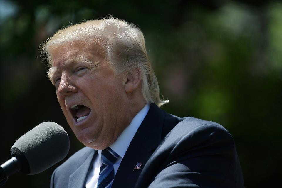 President Donald Trump campaigned on a promise to "cancel" the Paris Agreement. (Photo: Mandel Ngan/AFP/Getty Images)