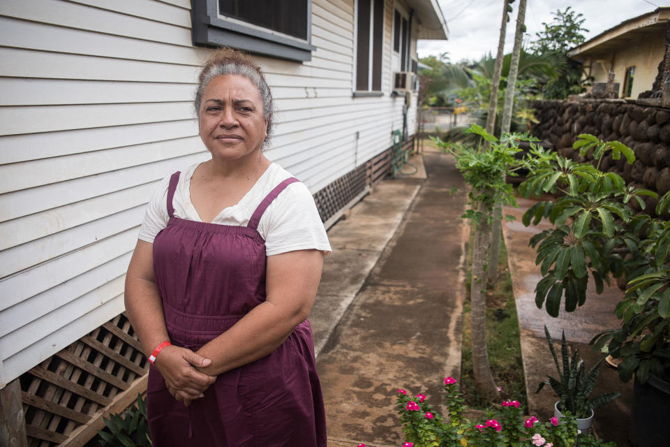 Etina Hingano survived the Lahaina fire by climbing over a sea wall and standing in the waves for 6 hours.  (Brock Stoneham / NBC News)