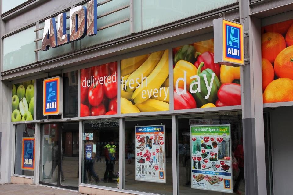 People visit Aldi supermarket on April 21, 2013 in Manchester, UK. Aldi is one of largest global discount supermarket chains with 9,221 locations.