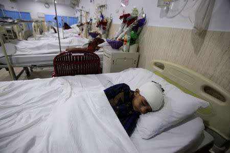 A child, injured during shelling along the disputed border between Pakistan and India, lies in bed at CMH hospital in Sialkot, Pakistan September 22, 2017. REUTERS/Mohsin Raza