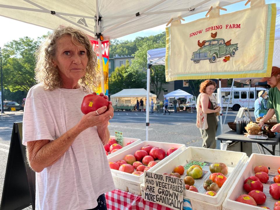 Peg Davis holds her Peg O' My Heart heirloom tomato that was accepted into the Seed Savers Exchange. “It’s such an honor," she says. "It makes me cry a little bit because I really worked on this tomato."