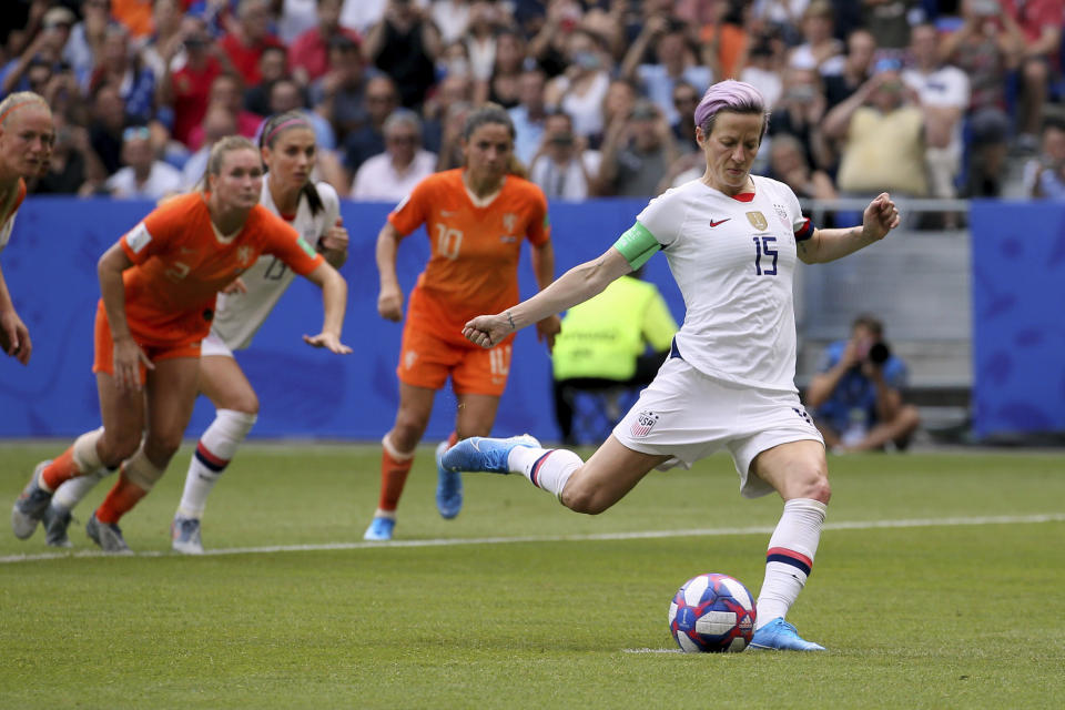 FILE - In this July 7, 2019, file photo, United States' Megan Rapinoe scores her side's opening goal from the penalty shot during the Women's World Cup final soccer match against The Netherlands at the Stade de Lyon in Decines, outside Lyon, France. Rapinoe has returned to the U.S. national team after sitting out most of last year following the SheBelieves Cup tournament, joining the squad for its January training camp in Florida. (AP Photo/David Vincent, File)