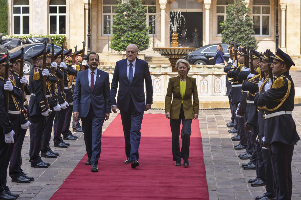 Lebanese caretaker Prime Minister Najib Mikati, center, welcomes Cyprus' President Nikos Christodoulides, left, and President of the European Commission Ursula von der Leyen at the government palace in Beirut, Lebanon, Thursday, May 2, 2024. (AP Photo/Hassan Ammar)