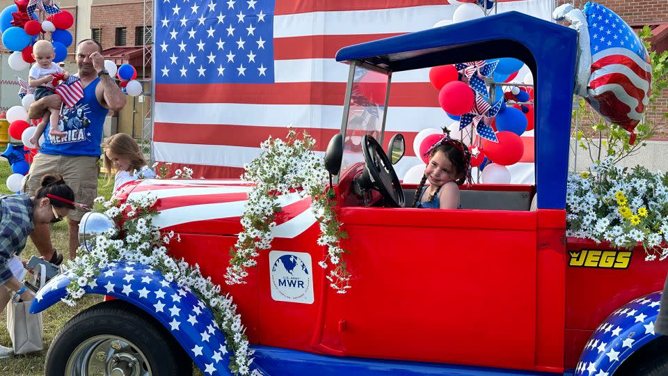 One of Camp Humphreys' younger residents poses for photos during the base's 2024 Fourth of July celebration. - Yoonjung Seo/CNN