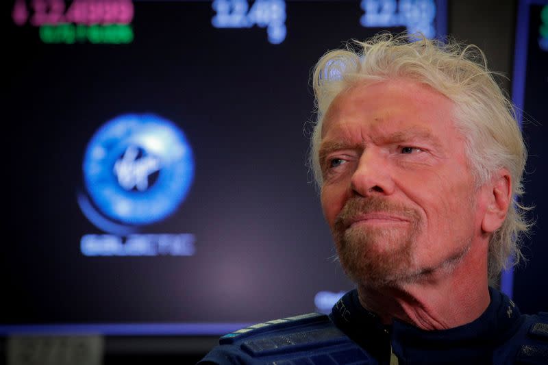 FILE PHOTO: Sir Richard Branson stands on floor of the NYSE as Virgin Galactic (SPCE) begins public trading in New York