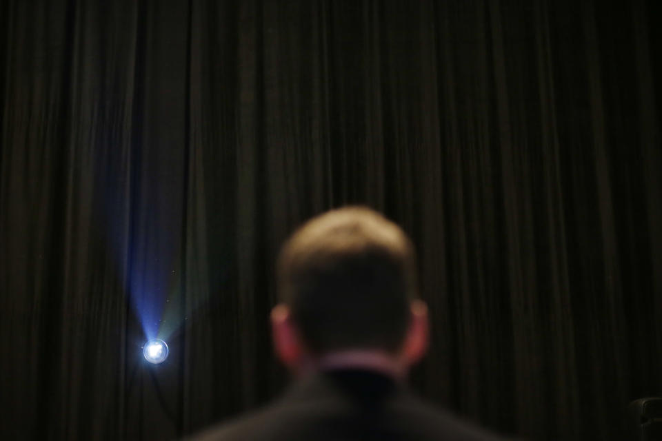 In this Monday, May 20, 2013 photo, Sony Electronics business development manager Keith Vidger stands against a beam of light from a movie projector as he explains about 4K digital cameras at Sony Pictures Studios in Culver City, Calif. Sony Corp., one of the first makers of 4K, or “ultrahigh definition,” television sets, is coming out on Friday, May 31, 2013, with one of the first movies to be both shot and presented in the format, “After Earth.” (AP Photo/Jae C. Hong)