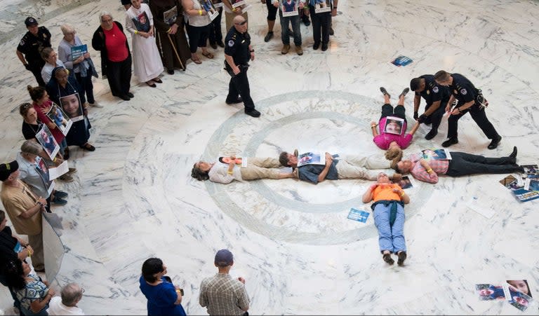 Dozens of nuns and priests have been arrested while protesting on Capitol Hill against Donald Trump‘s child detention policies.As part of a protest involving a number of religious groups, up to 200 priests, nuns and lay people sat ot lay down on the marble floors beneath the rotunda in the Russell senate building. At least 65 were then arrested and taken away by Capitol police.The protests, which the activists called a “Catholic day of action for detained immigrant children”, was just the latest involving faith groups across the country, which have been holding events to draw attention to the president’s immigration and detention policies. Non-faith groups have also been holding events about the policies, that have resulted in the splitting up of families, the rewriting of asylum laws to make it more difficult for migrants to enter the US, and the holding of minors in miserable conditions that the UN has decried as “appalling”. All the while, Mr Trump has stepped up his rhetoric on immigration, part of a calculated strategy he believes will help him win reelection in 2020.“As people of faith, we lose our credibility if we don’t speak out about what our government is dong,” Kelsie Herbert, a spokesperson for Faith in Public Life, one of the group’s involved in the protest, told The Independent.She added: “Children are sacred. Jesus very clearly said we had to take care of children. When our government is treating children in the way it is, the faith community has to speak up.”The group said several Catholic bishops had sent statements of support for the civil disobedience action.Roll Call, which first reported on the protests and arrests on Thursday, quoted Eva Malecki, a Capitol Police spokeswoman, saying the people were arrested for “unlawfully demonstrating in the rotunda of the Russell Senate Office Building”. “All were charged with DC code §22-1307, crowding, obstructing, or incommoding,” she said.Walter Liss, a Franciscan brother who attended the protest, said: “I just think that we can do better as a nation. I just don’t like what I’ve seen on TV the way that people are being treated and or scapegoated, you know, how people especially people of colour from other countries are being blamed for all sorts of problems in society.”