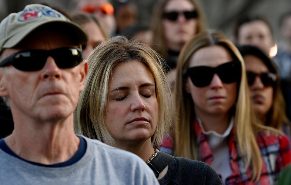 People gather during the Nashville Remembers candlelight vigil to mourn the Covenant School victims at Public Square Park Wednesday, March 29, 2023, in Nashville, Tenn.