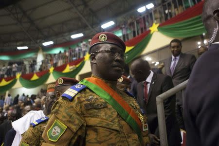 Burkina Faso's Prime Minister Lieutenant Colonel Isaac Zida attends the swearing-in ceremony of newly named President Michel Kafondo in Ouagadougou November 21, 2014. REUTERS/Joe Penney