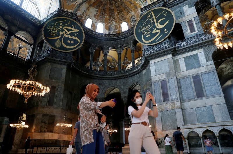 FILE PHOTO: People pose for a selfie as they visit the Hagia Sophia or Ayasofya in Istanbul