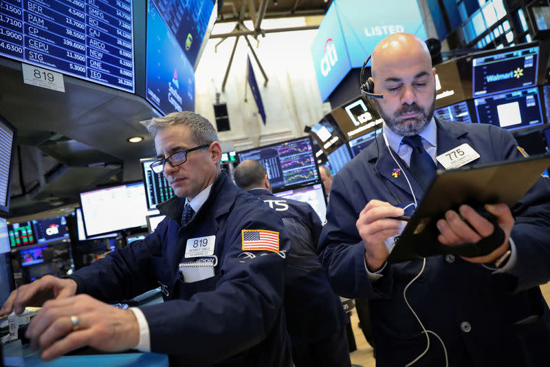 Traders work on the floor of the New York Stock Exchange (NYSE) in New York, U.S., February 13, 2019. REUTERS/Brendan McDermid