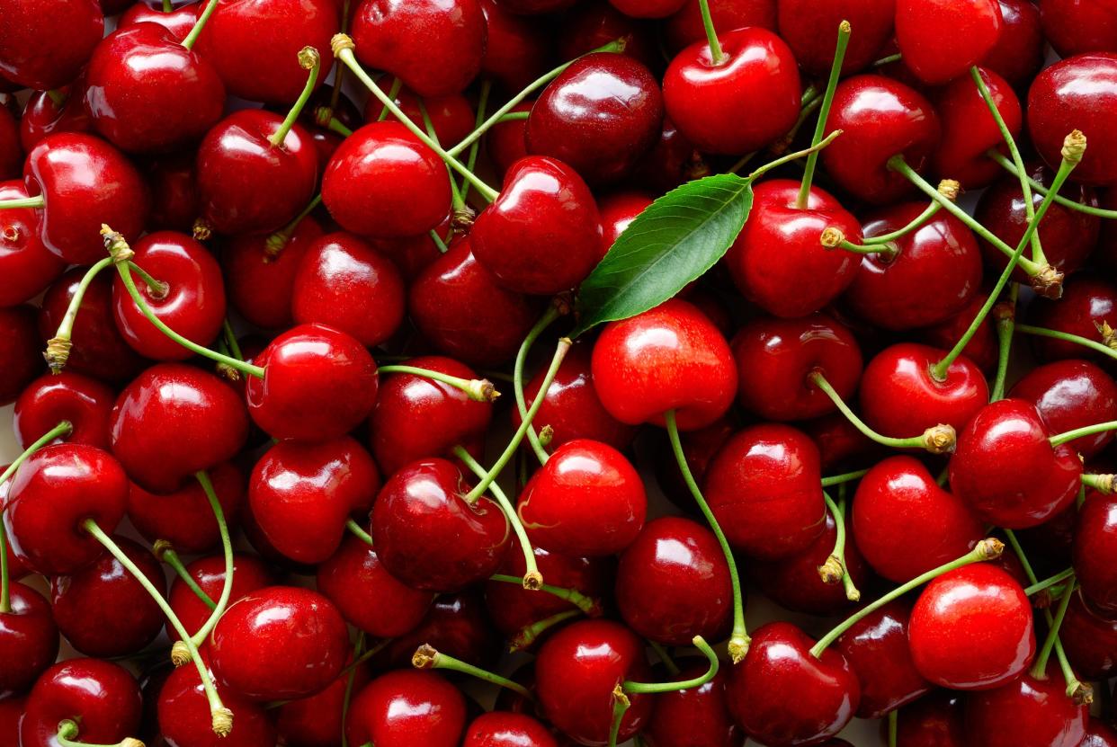 Close up of a big pile of fresh red cherries.