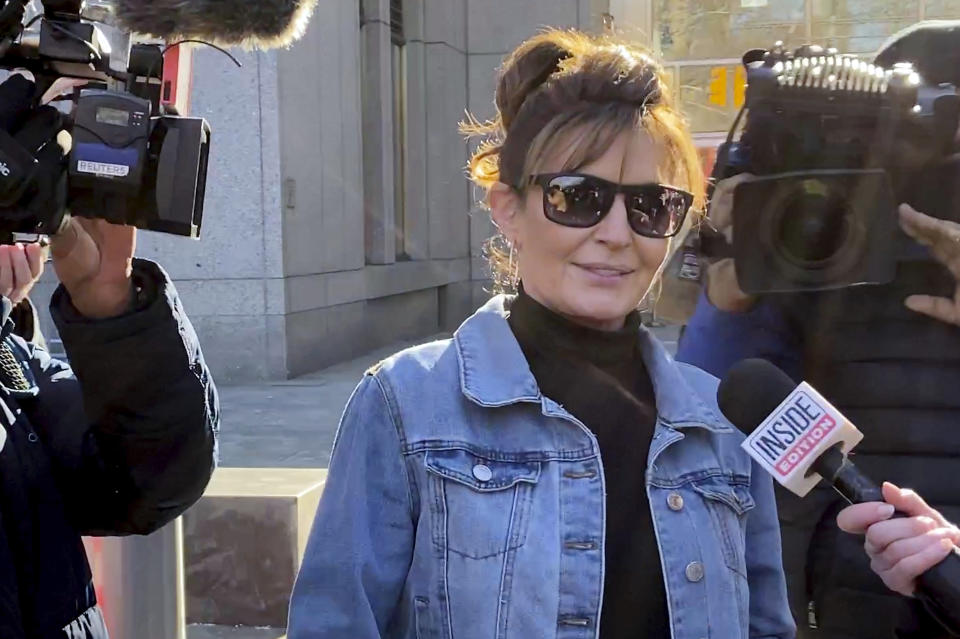 Former Alaska Gov. Sarah Palin leaves a courthouse in New York, Tuesday, Feb. 15, 2022. Palin lost her libel lawsuit against The New York Times on Tuesday when a jury rejected her claim that the newspaper maliciously damaged her reputation by erroneously linking her campaign rhetoric to a mass shooting. (AP Photo/David Martin)