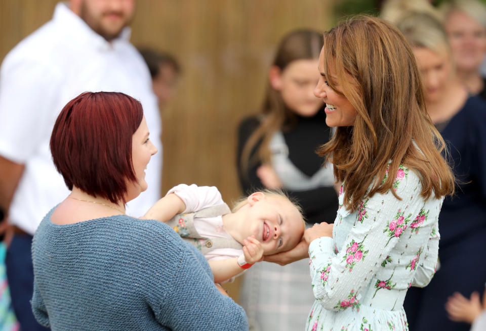 The royal greets a young well-wisher during the event [Photo: Getty]