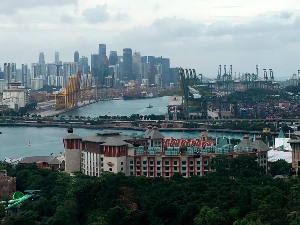 Sentosa Island and the causeway connecting it to mainland Singapore are seen with the city-state’s main skyscraper-studded island in the background.