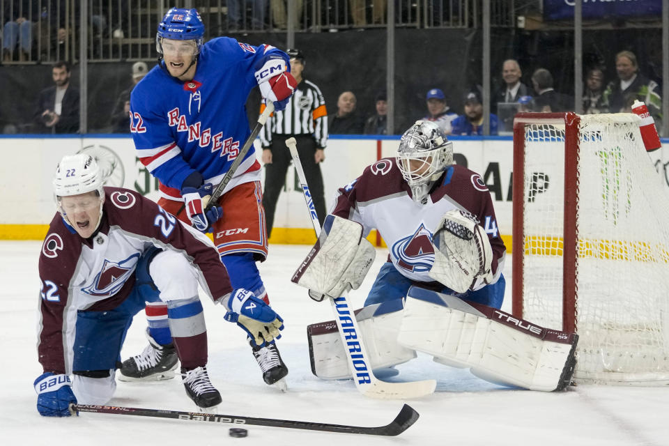 Colorado Avalanche left wing Fredrik Olofsson (22) and goaltender Alexandar Georgiev (40) tend the net against the New York Rangers during the second period of an NHL hockey game, Monday, Feb. 5, 2024, at Madison Square Garden in New York. (AP Photo/Mary Altaffer)