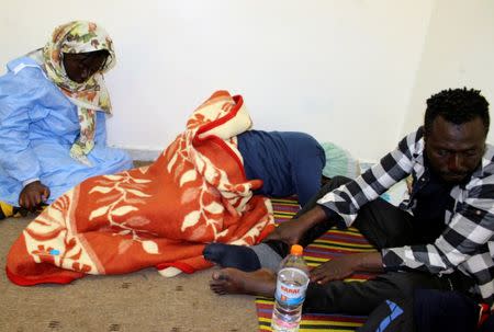 Survivor migrants who were in a boat spending 12 days at sea without food or water are seen in Misrata, Libya December 4, 2018. REUTERS/Ayman al-Sahili