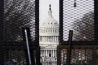 Security surrounds the U.S. Capitol in Washington, Friday, Jan. 15, 2021, ahead of the inauguration of President-elect Joe Biden and Vice President-elect Kamala Harris. (AP Photo/Susan Walsh)