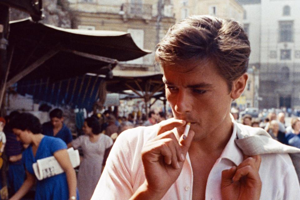 Alain Delon smoking a cigarette