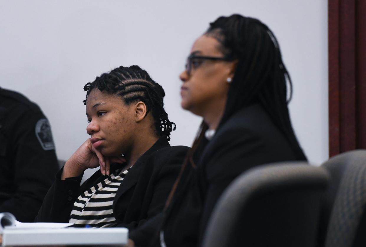 Abbieana Williams sits with one of her attorneys during her trial in the courtroom of Judge Clinton Canady, III, Friday, April 8, 2022.