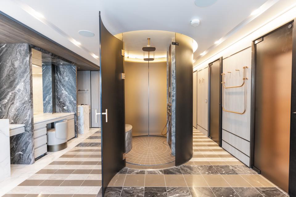 The primary bathroom in the suite is a spa unto itself, complete with Cocoon fixtures, a jetted bathtub, separate shower, and heated lounge area.