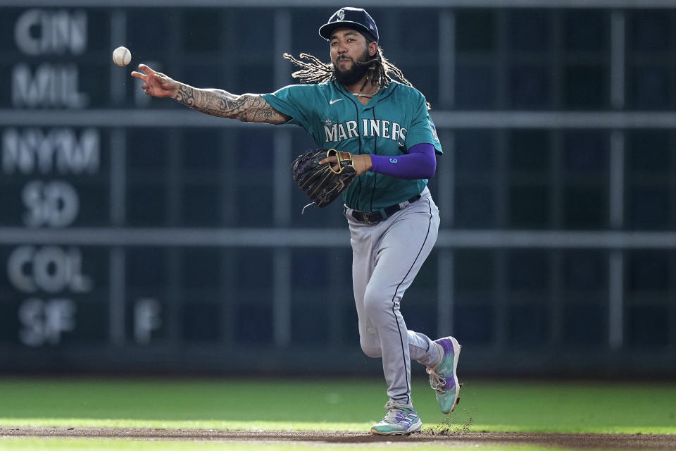 Seattle Mariners shortstop J.P. Crawford throws out Houston Astros' Mauricio Dubon at first during the first inning of a baseball game Saturday, July 8, 2023, in Houston. (AP Photo/Kevin M. Cox)