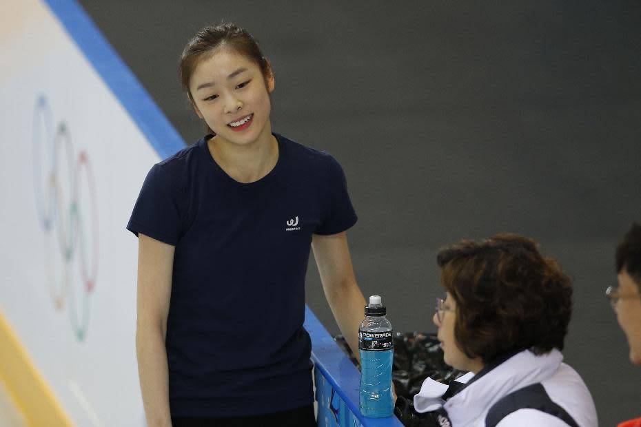Yuna Kim of South Korea smiles during a practice session at the figure stating practice rink at the 2014 Winter Olympics, Monday, Feb. 17, 2014, in Sochi, Russia. (AP Photo/Vadim Ghirda)