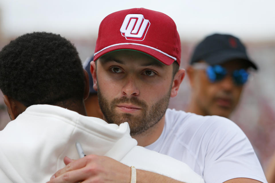 NORMAN, OK - APRIL 23:  Quarterback Baker Mayfield of the Oklahoma Sooners greets a former player during the team's spring game at Gaylord Family Oklahoma Memorial Stadium on April 23, 2022 in Norman, Oklahoma.   (Photo by Brian Bahr/Getty Images)