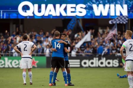 San Jose Earthquakes forward Chris Wondolowski (8) hugs forward Adam Jahn (14) after the win against the Chicago Fire during the second half at Avaya Stadium. The San Jose Earthquakes defeated the Chicago Fire 2-1. Mandatory Credit: Kelley L Cox-USA TODAY Sports