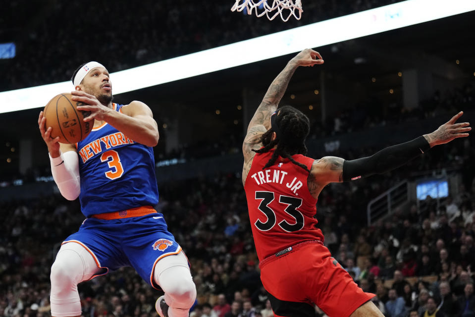 New York Knicks guard Josh Hart (3) looks to shoot as Toronto Raptors guard Gary Trent Jr. (33) defends during the second half of an NBA basketball game Wednesday, March 27, 2024, in Toronto. (Frank Gunn/The Canadian Press via AP)