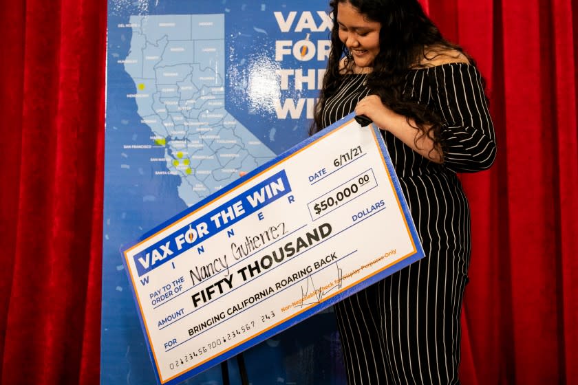 VISTA, CA - JUNE 11: California Governor Gavin Newsom announces 15 winners in the state's "Vax for the Win" vaccine incentive program at Vista Community Clinic on Friday, June 11, 2021 in Vista, CA. Newsom announced the winners alongside 17-year-old Nancy Gutierrez, who was one of the 30 total winners who will receive $50,000 each. (Sam Hodgson / The San Diego Union-Tribune)