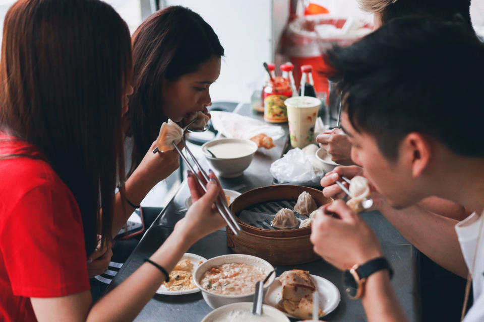 Young asian people is eating taiwan local food