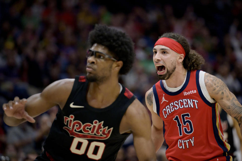 New Orleans Pelicans guard Jose Alvarado (15) yells after a basket, next to Portland Trail Blazers guard Scoot Henderson (00) during the first half of an NBA basketball game in New Orleans, Saturday, March 16, 2024. (AP Photo/Matthew Hinton)