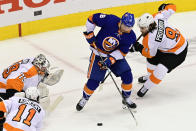 New York Islanders left wing Anthony Beauvillier (18) tries to shoot as Philadelphia Flyers defenseman Ivan Provorov (9) defends and Flyers goaltender Carter Hart (79) and center Travis Konecny (11) look on during first-period NHL Stanley Cup Eastern Conference playoff hockey game action in Toronto, Saturday, Aug. 29, 2020. (Frank Gunn/The Canadian Press via AP)