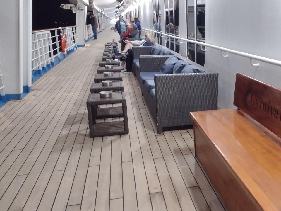 A designated smoking area on the deck of a Carnival cruise ship.