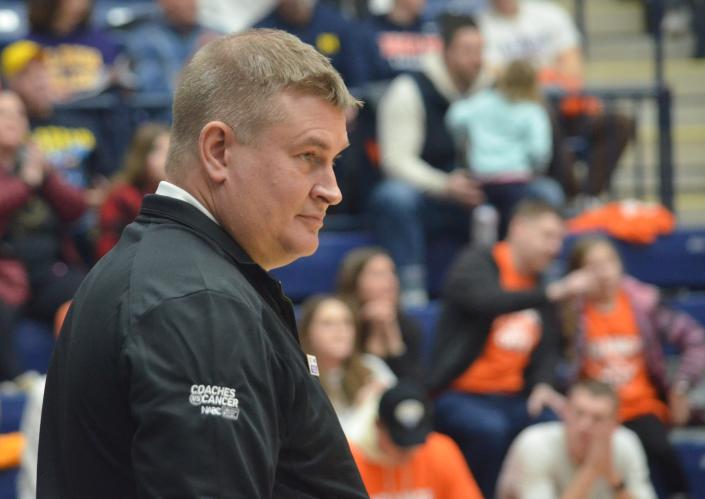 Albion basketball coach Jody May watches his team's offense on Saturday at Hope College in Holland.