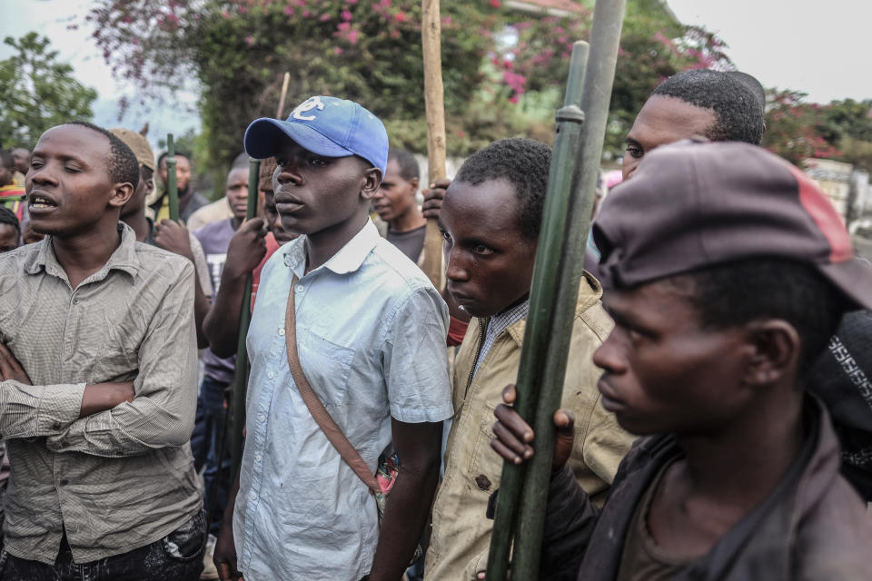 Demonstrators face police during a protest against the United Nations peacekeeping force (MONUSCO) deployed in the Democratic Republic of the Congo in Sake, some 15 miles (24 kms) west of Goma, Wednesday July 27, 2022. Officials say more than 15 people have been killed and dozens injured during the demonstrations against the UN mission in the country, heading into their third day. (AP Photo/Moses Sawasawa)