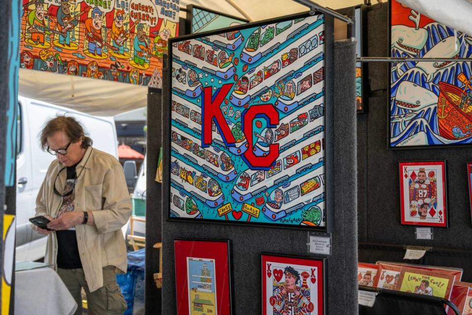 Charlie Podrebarac displays his art in his booth Friday before the Brookside Art Annual. Podrebarac’s art was also featured in this year’s Parade of Hearts.