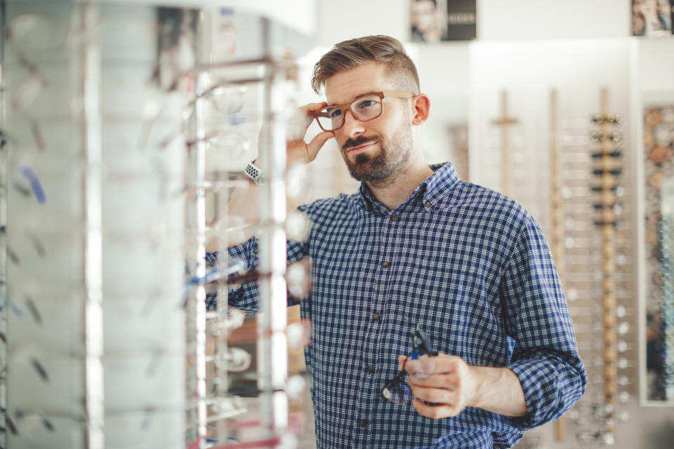 person shopping for glasses