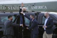 President Joe Biden waves as he gets into a motorcade vehicle after stepping off Marine One at Delaware Air National Guard Base in New Castle, Del., Friday, April 16, 2021. Biden is spending the weekend at his home in Delaware. (AP Photo/Patrick Semansky)
