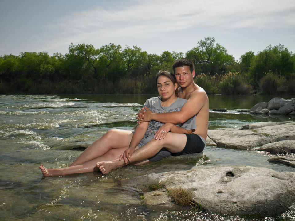 <p>“Alicia and Allen Alejandro, newlyweds in their 20s, play hooky at an abandoned trailer park on the bank of the Rio Grande. They told me that sometimes the cartel have gunfights right here at this very spot. They supported Clinton.” (Photograph and caption by Naomi Harris) </p>