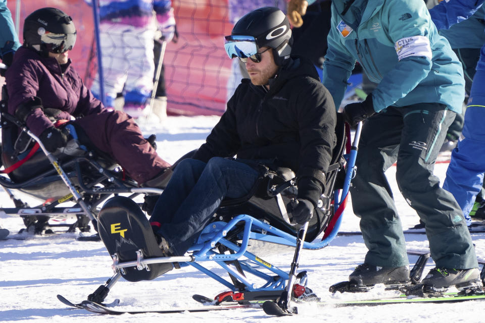 Britain's Prince Harry, The Duke of Sussex, prepares to sit ski with Invictus athletes during the Invictus Games training camp in Whistler, British Columbia, on Wednesday, Feb. 14, 2024. (Ethan Cairns/The Canadian Press via AP)