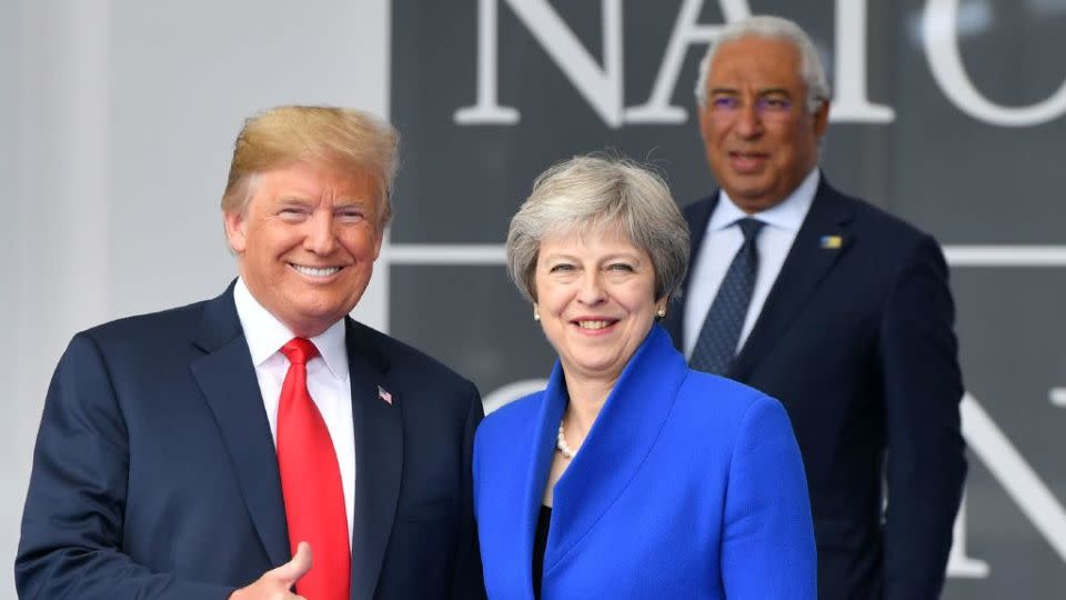 Donald Trump with former British PM Theresa May at NATO HQ in 2018. Trump had already caused alarm with anti-NATO comments earlier in his presidency. - (EMMANUEL DUNAND/AFP/Getty Images)