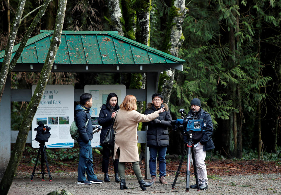 Members of the news media wait at the base of Horth Hill close to the property where according to British news reports Prince Harry and Meghan, Duchess of Sussex are staying in North Saanich, British Columbia, Canada January 21, 2020. REUTERS/Kevin Light