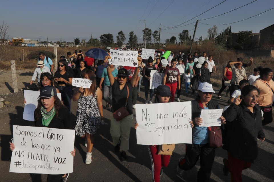 Demonstrators march to protest the murder of Fatima, a 7-year-old girl who was abducted from the entrance of the Enrique C. Rebsamen primary school and later killed, in Mexico City, Monday, Feb. 17, 2020. The girl’s body was found wrapped in a bag and abandoned in a rural area on Saturday and was identified by genetic testing. (AP Photo/Marco Ugarte)